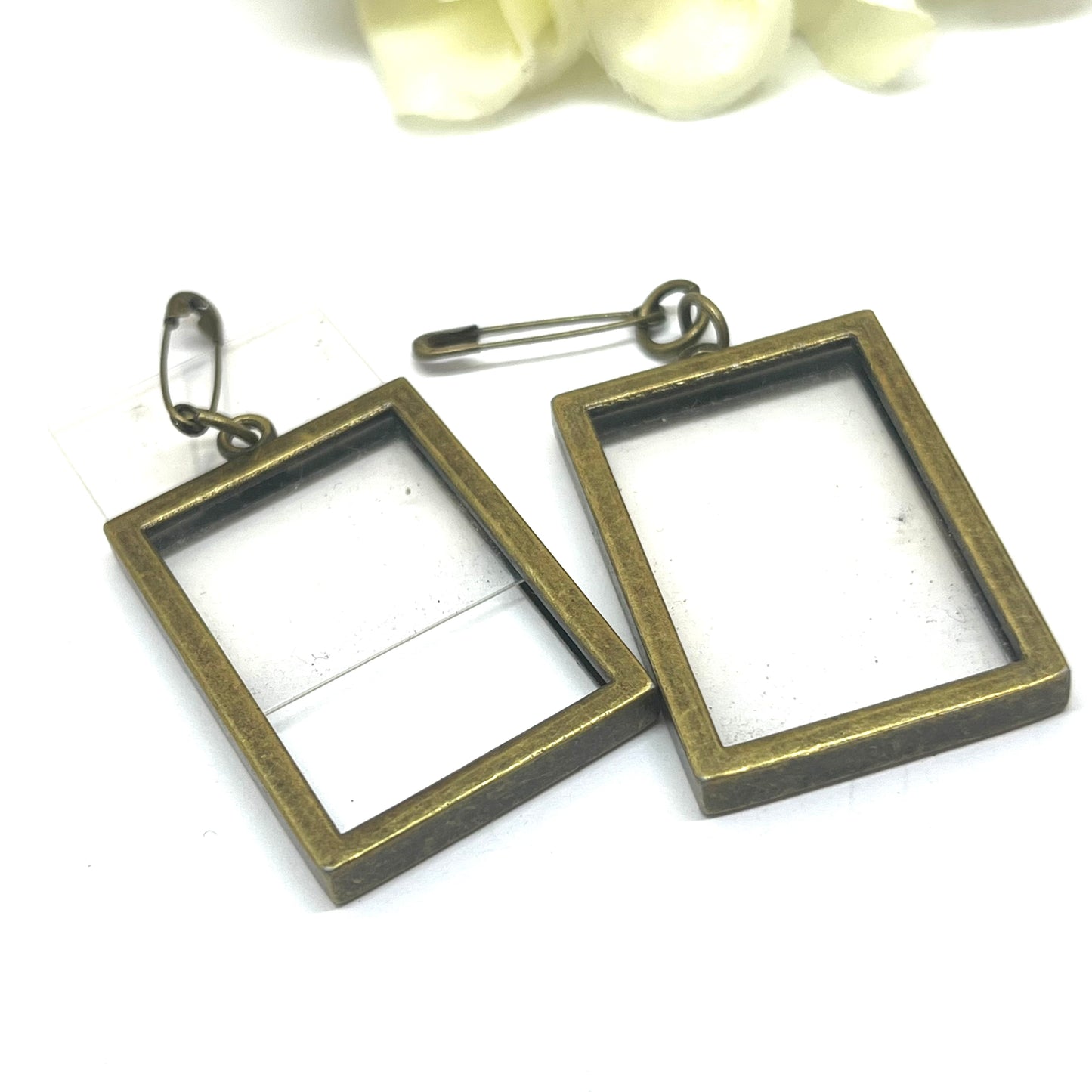 Bronze wedding photo charms for wedding flowers attached with safety pins