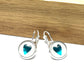 Metallic Aqua blue heart glass dome earrings in a silver setting