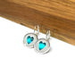 Pretty Aqua blue heart glass dome earrings in a silver setting