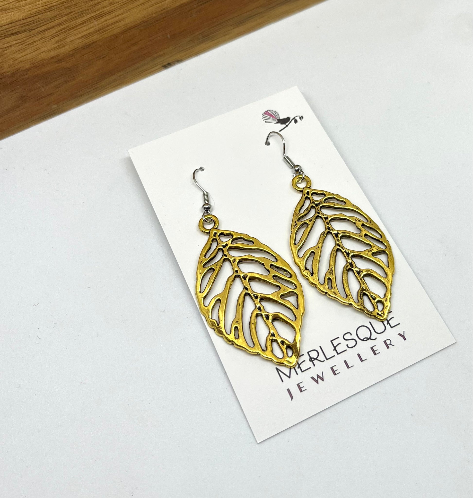 Long gold hot sale leaf earrings